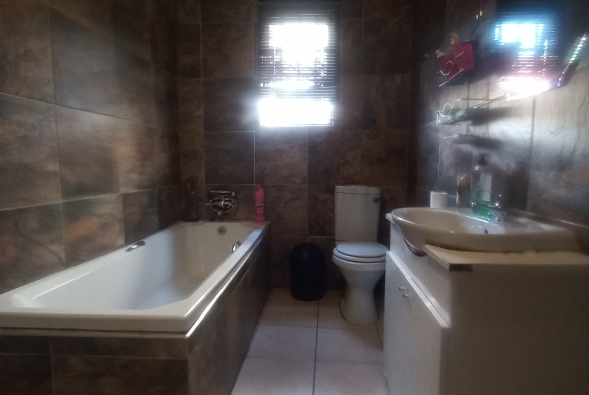 Prime Investment Opportunity in Amalinda Forest: 3-Bedroom House + 4 Income-Generating Flats!